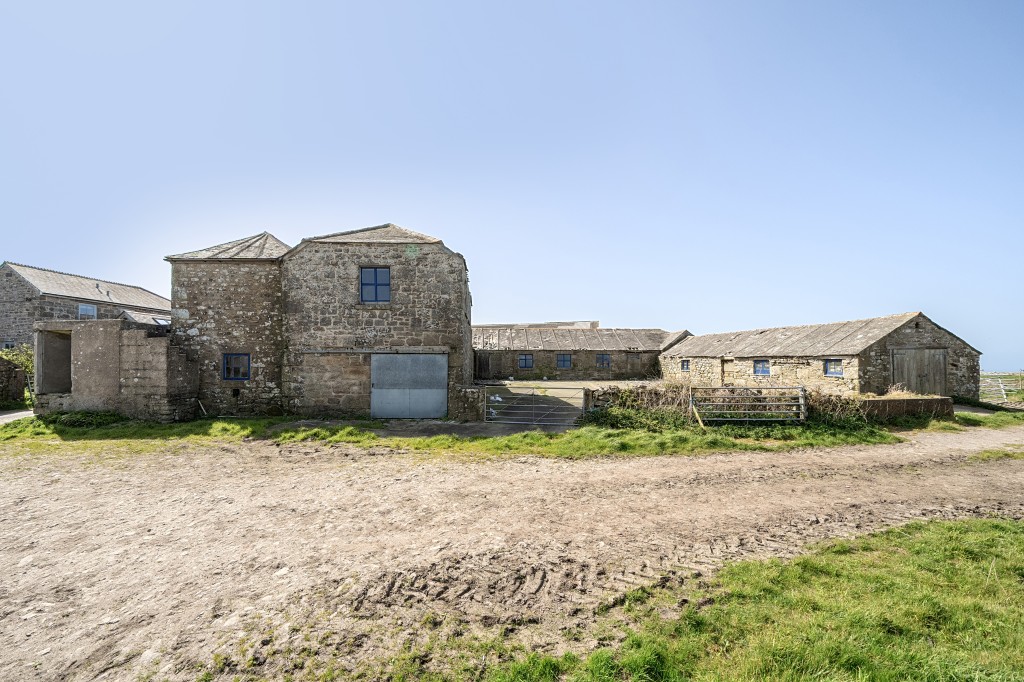 Lot: 3 - COMPLEX OF GRANITE BARNS, DUTCH BARN, CATTLE SHED FARMYARD AND LAND WITH POTENTIAL - External photograph of three granite barns and yard areas